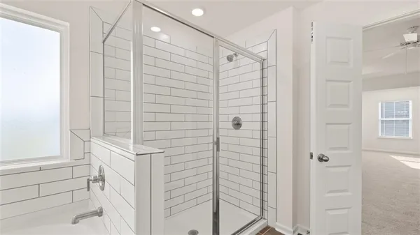 a bathroom with a bathtub and a sink