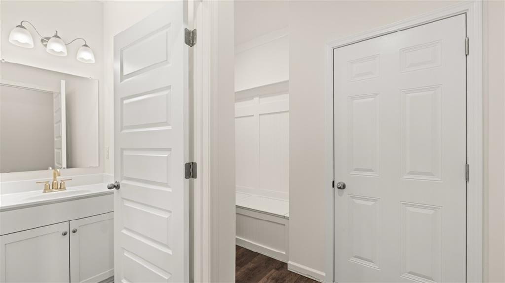 1779 Goodwin Drive Hampton, GA 30228 - Photo 42 of 49 a bathroom with a shower sink and mirror