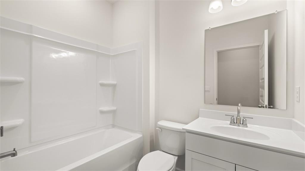 1779 Goodwin Drive Hampton, GA 30228 - Photo 43 of 49 a bathroom with a sink toilet and shower