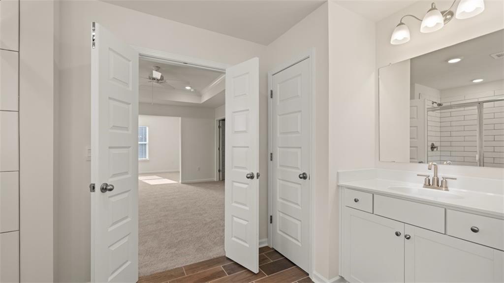 1779 Goodwin Drive Hampton, GA 30228 - Photo 44 of 49 a bathroom with a double vanity sink mirror and shower