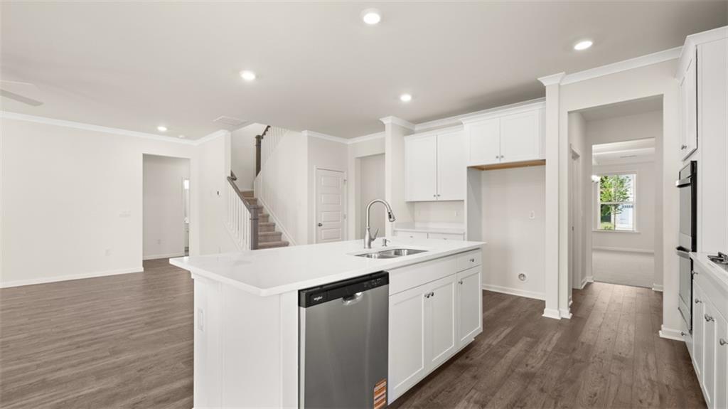 1779 Goodwin Drive Hampton, GA 30228 - Photo 7 of 49 a kitchen with a sink a refrigerator and a stove top oven