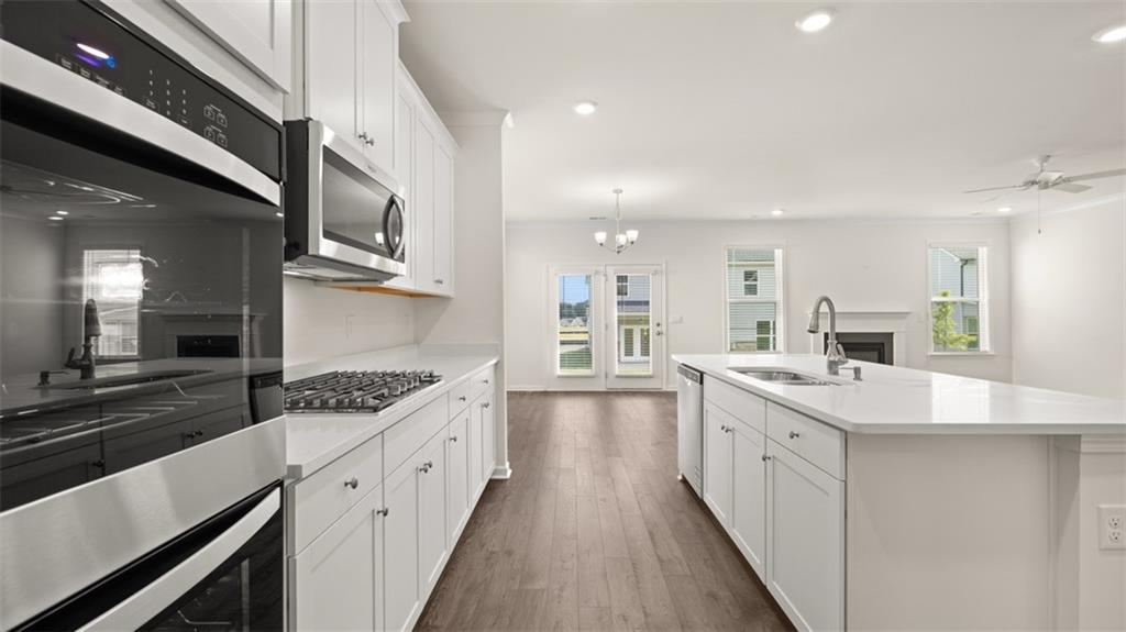 1779 Goodwin Drive Hampton, GA 30228 - Photo 9 of 49 a kitchen with sink stove and cabinets