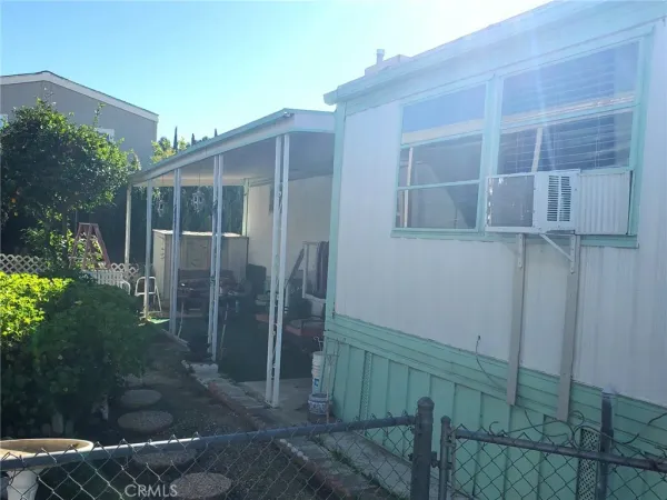 a view of backyard with potted plants