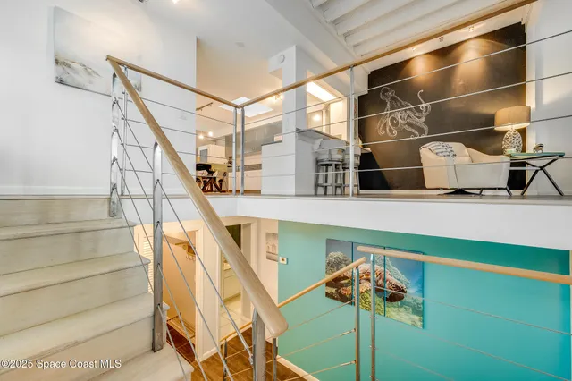 a bathroom with a granite countertop toilet sink and mirror