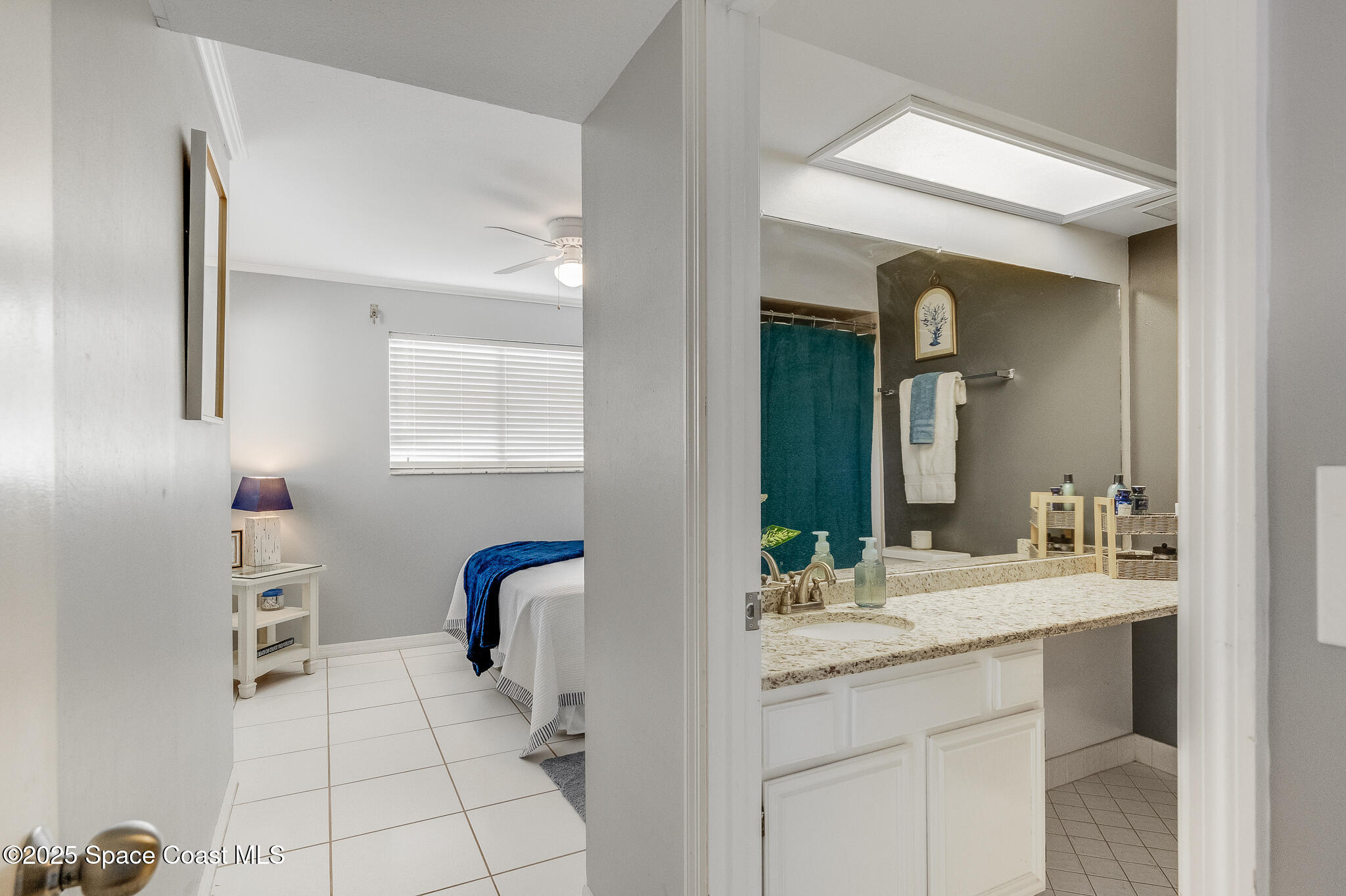 3319 Kirkland Road Northeast Palm Bay, FL 32905 - Photo 12 of 50 a en suite bathroom with a double vanity sink mirror and bathtub