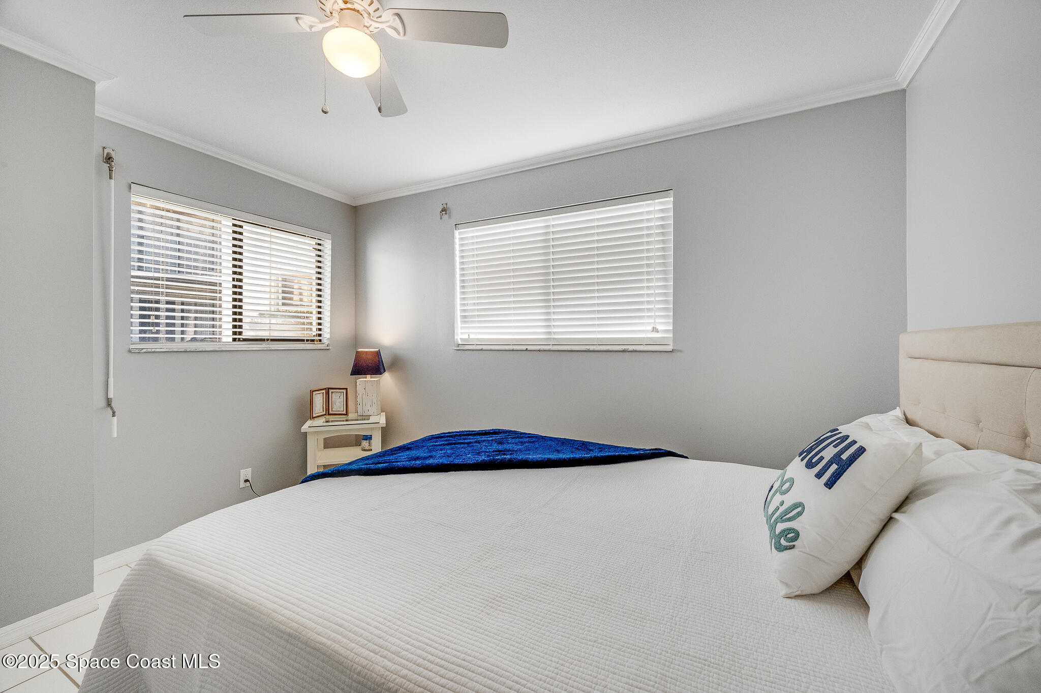 3319 Kirkland Road Northeast Palm Bay, FL 32905 - Photo 15 of 50 a bedroom with a bed and a chandelier