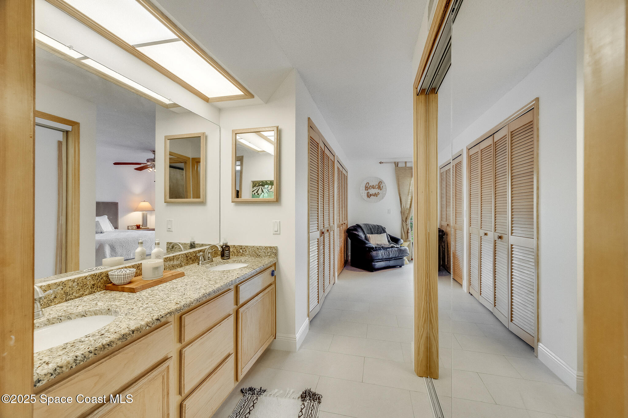 3319 Kirkland Road Northeast Palm Bay, FL 32905 - Photo 19 of 50 a spacious bathroom with a sink double vanity and a mirror