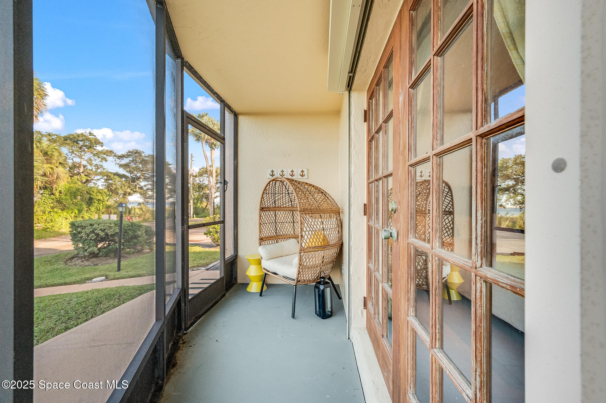 3319 Kirkland Road Northeast Palm Bay, FL 32905 - Photo 22 of 50 a view of living room with a large window and front door