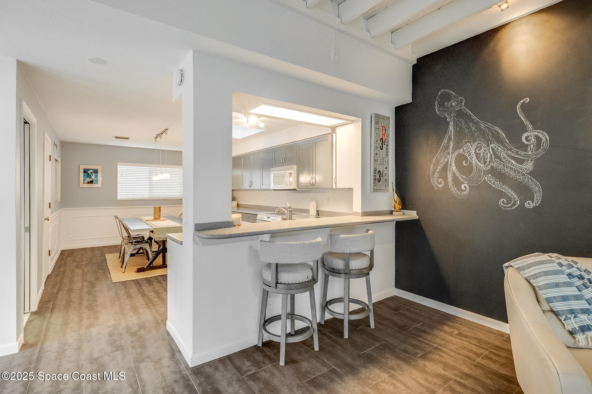 3319 Kirkland Road Northeast Palm Bay, FL 32905 - Photo 29 of 50 a kitchen with a sink cabinets and wooden floor