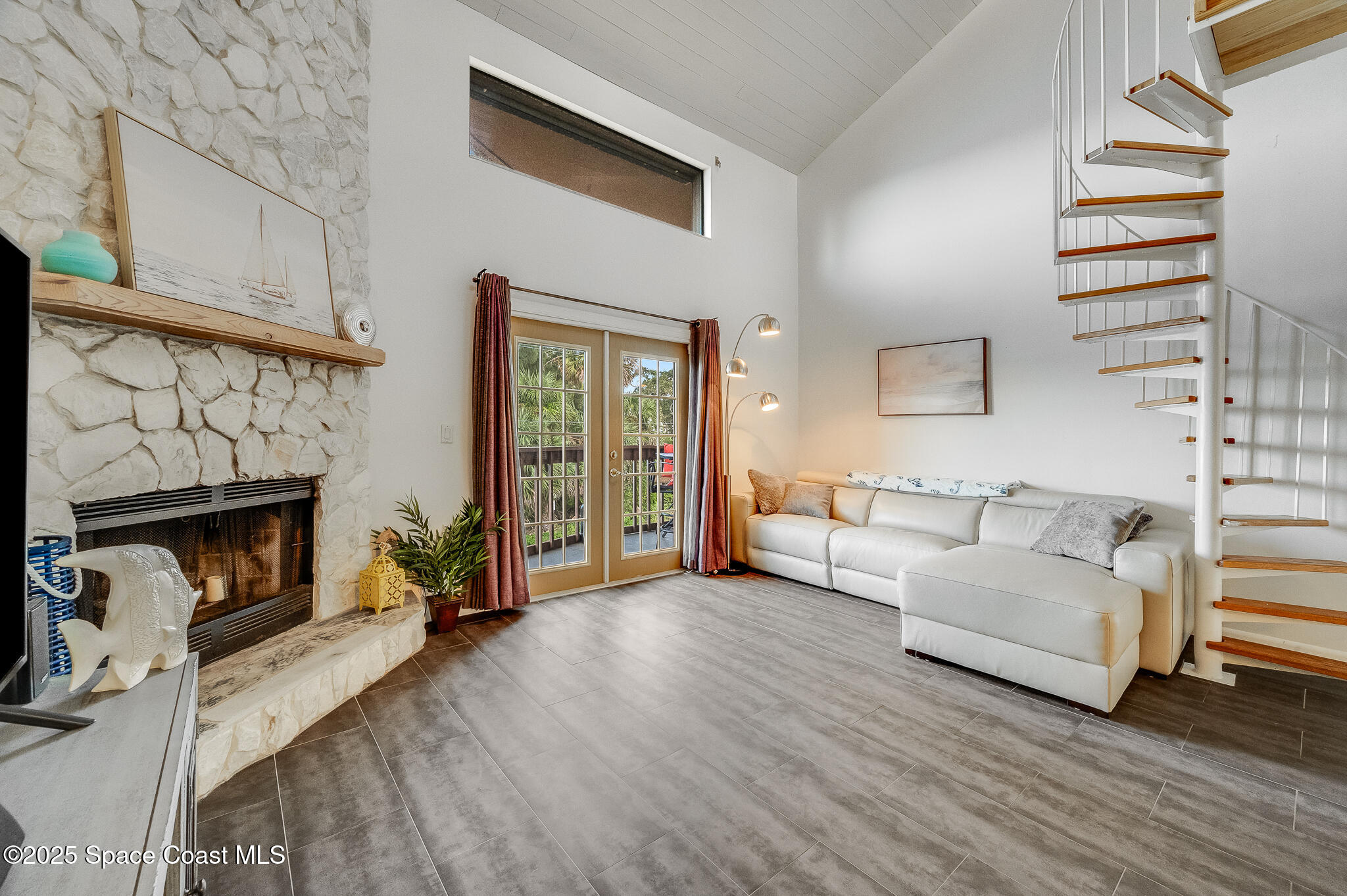 3319 Kirkland Road Northeast Palm Bay, FL 32905 - Photo 3 of 50 a living room with furniture and a fireplace