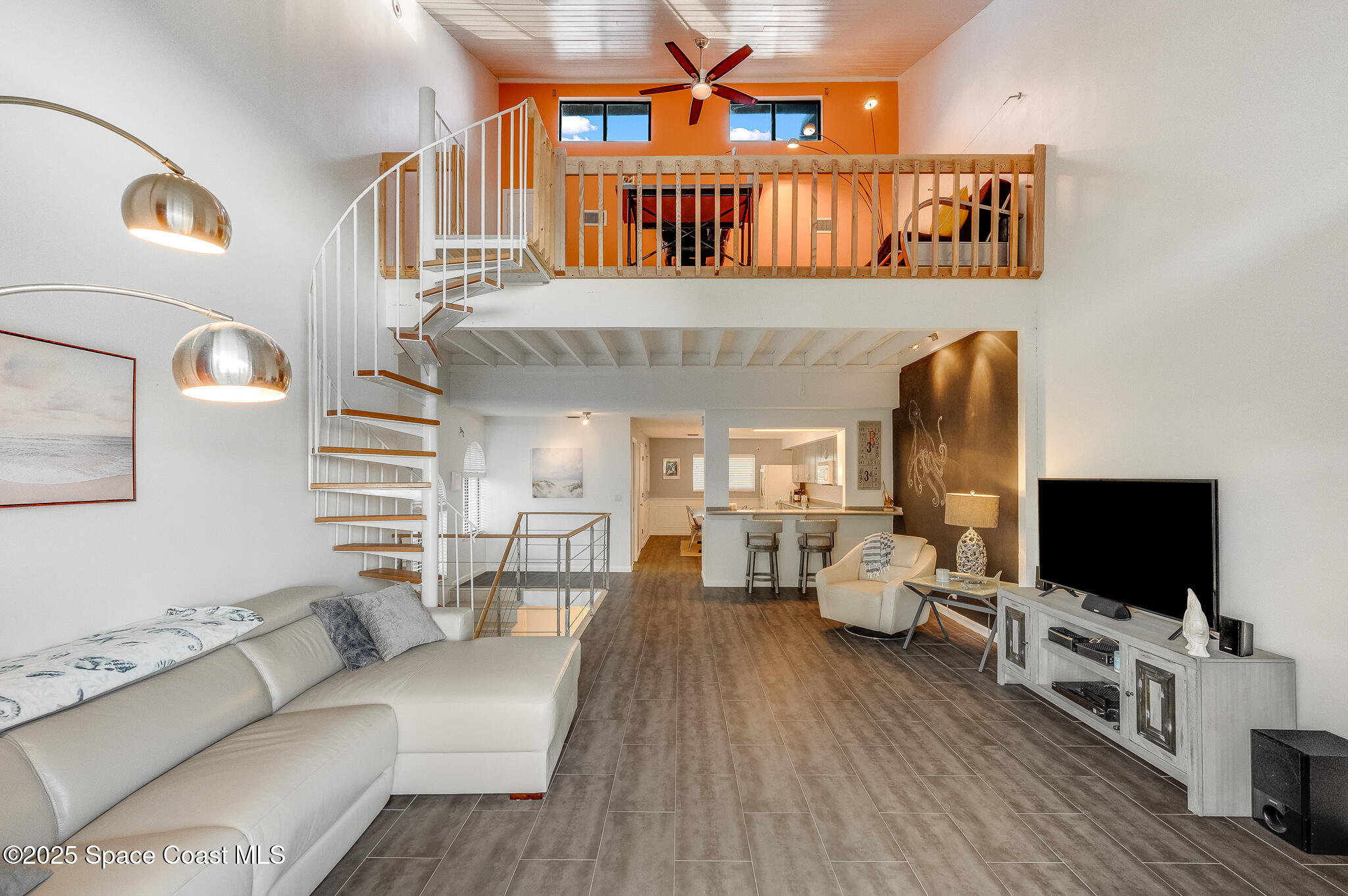 3319 Kirkland Road Northeast Palm Bay, FL 32905 - Photo 32 of 50 a living room with furniture and a flat screen tv