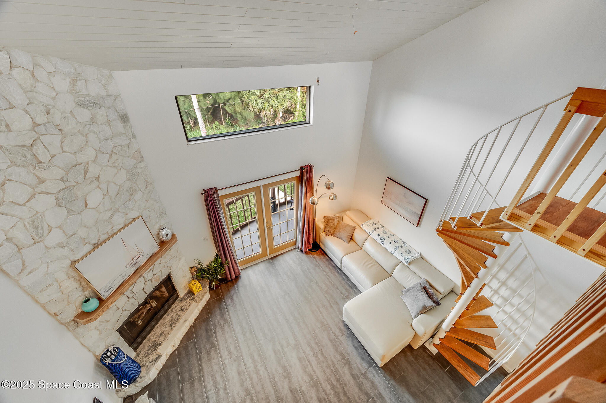 3319 Kirkland Road Northeast Palm Bay, FL 32905 - Photo 39 of 50 wooden floor with couches and a dining table with wooden floor