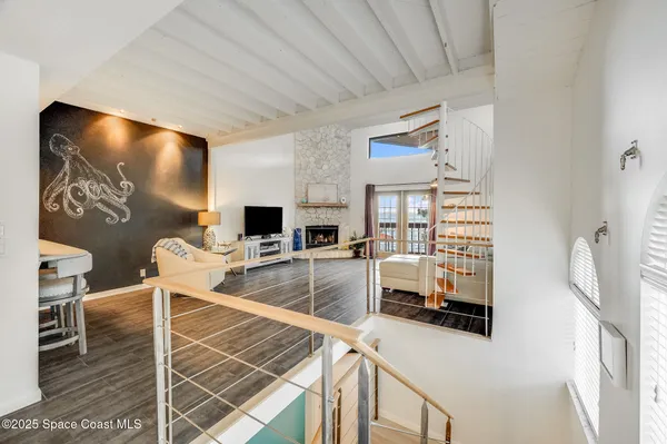 a spacious bedroom with a bed a couch and a window