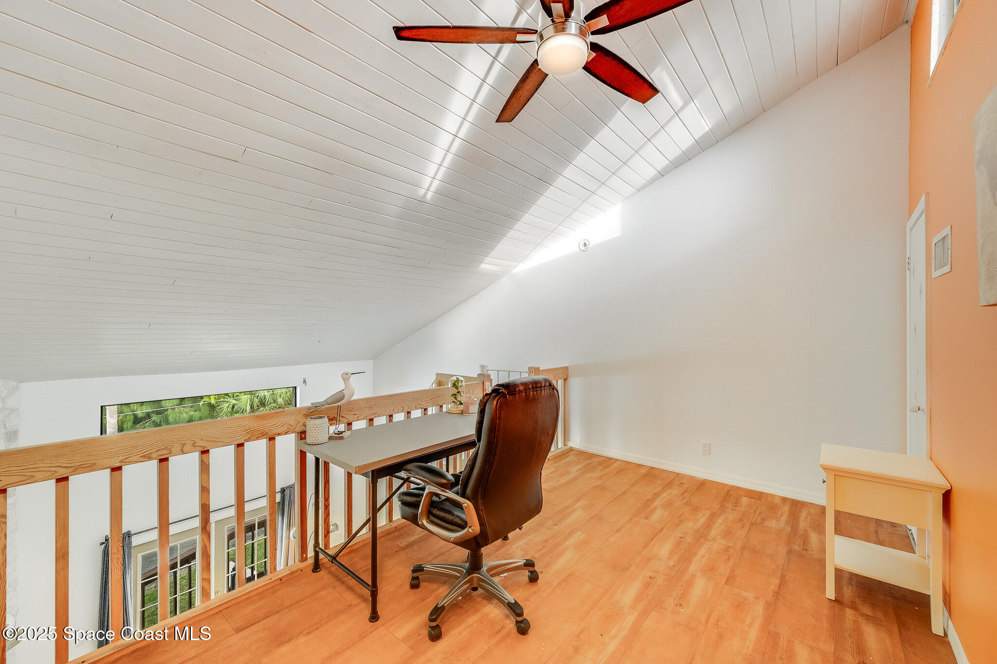 3319 Kirkland Road Northeast Palm Bay, FL 32905 - Photo 42 of 50 a view of a room with wooden floor and chair