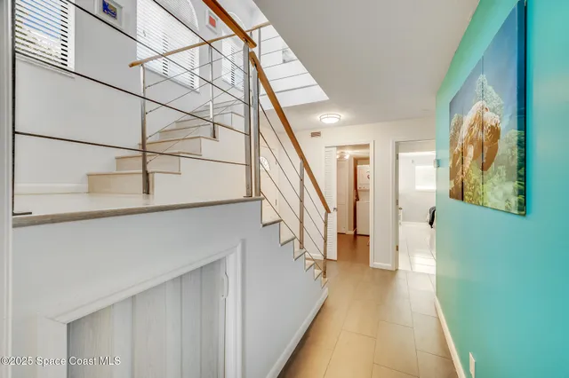 a en suite bathroom with a double vanity sink mirror and bathtub