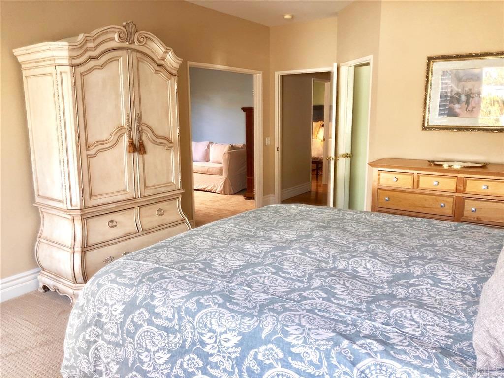 459 Lexington Circle Oceanside, CA 92057 - Photo 16 of 25 a bedroom with a bed dresser and mirror
