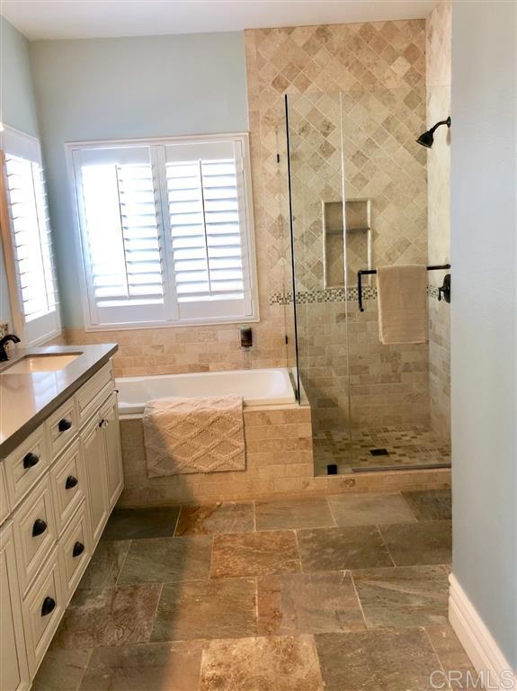 459 Lexington Circle Oceanside, CA 92057 - Photo 17 of 25 a bathroom with double vanity and a shower
