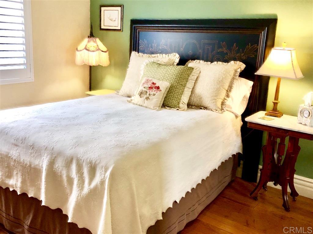 459 Lexington Circle Oceanside, CA 92057 - Photo 20 of 25 a bed room with a bed and a lamp