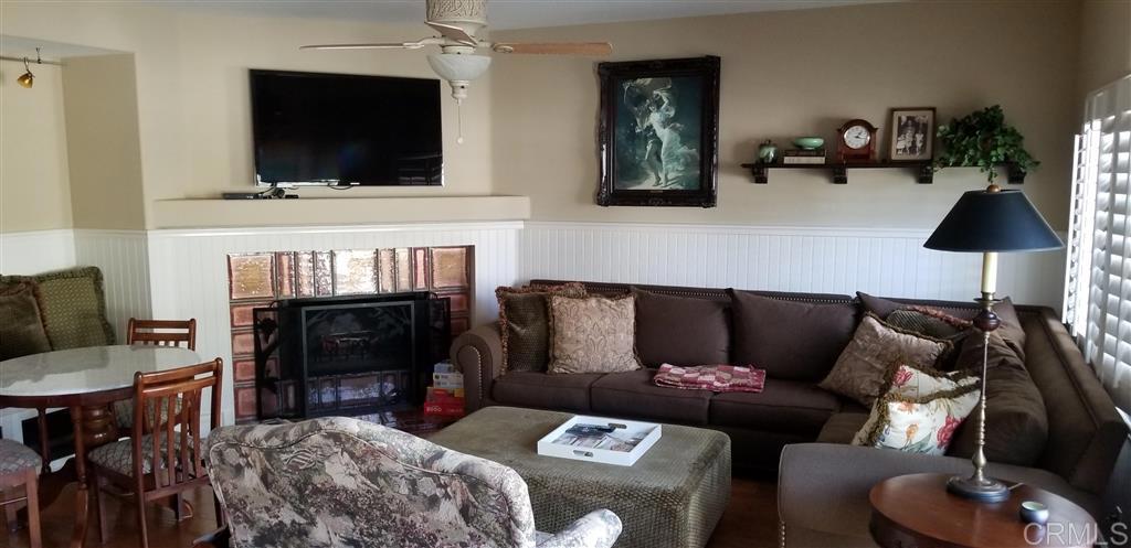 459 Lexington Circle Oceanside, CA 92057 - Photo 3 of 25 a living room with furniture and a flat screen tv