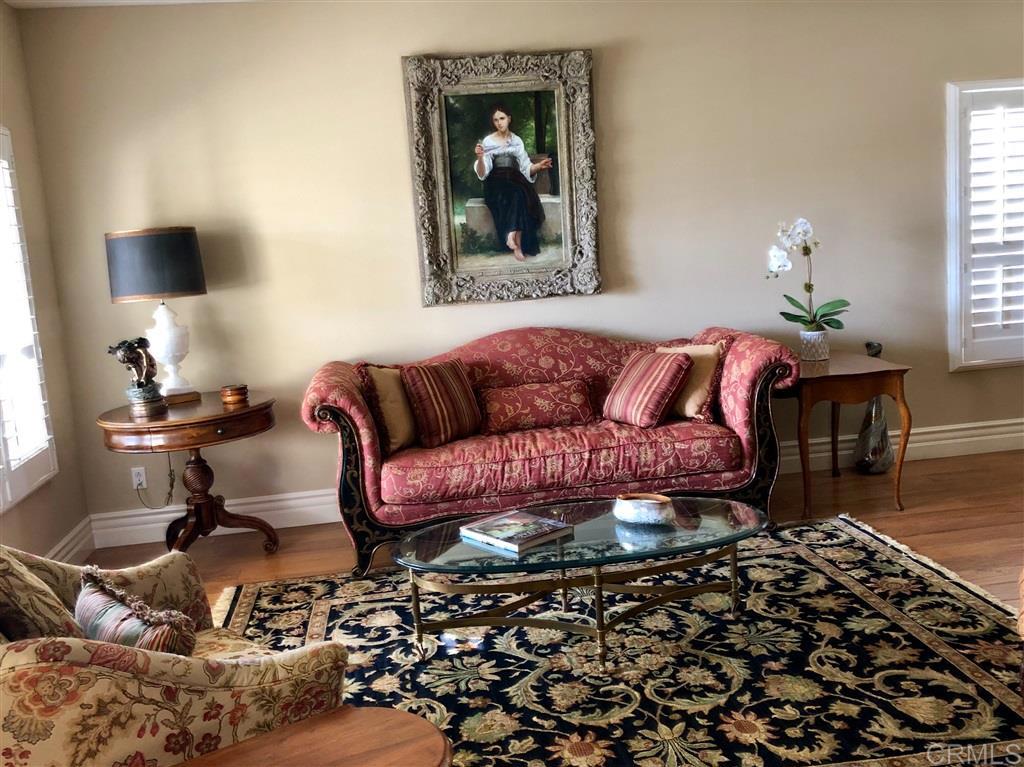 459 Lexington Circle Oceanside, CA 92057 - Photo 9 of 25 a living room with a couch and a potted plant