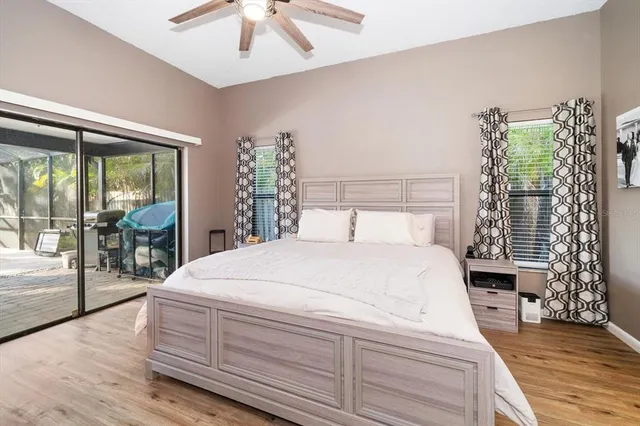 a bedroom with a large bed and a large window