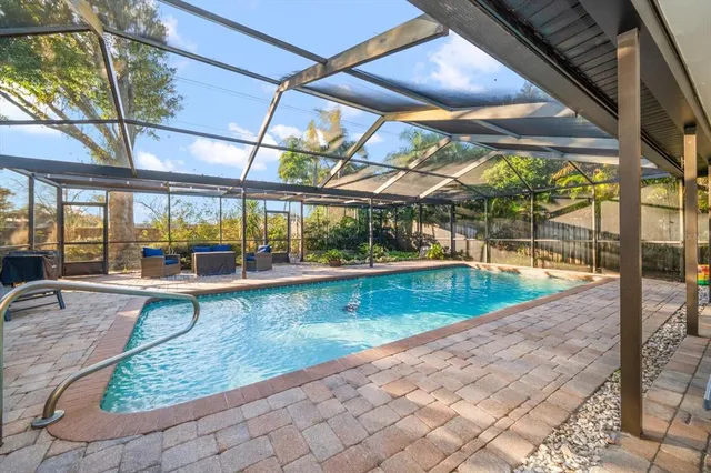 a view of a swimming pool with a patio