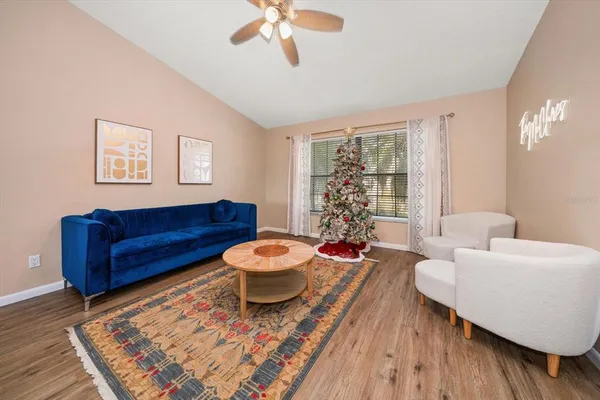 a living room with furniture and a rug