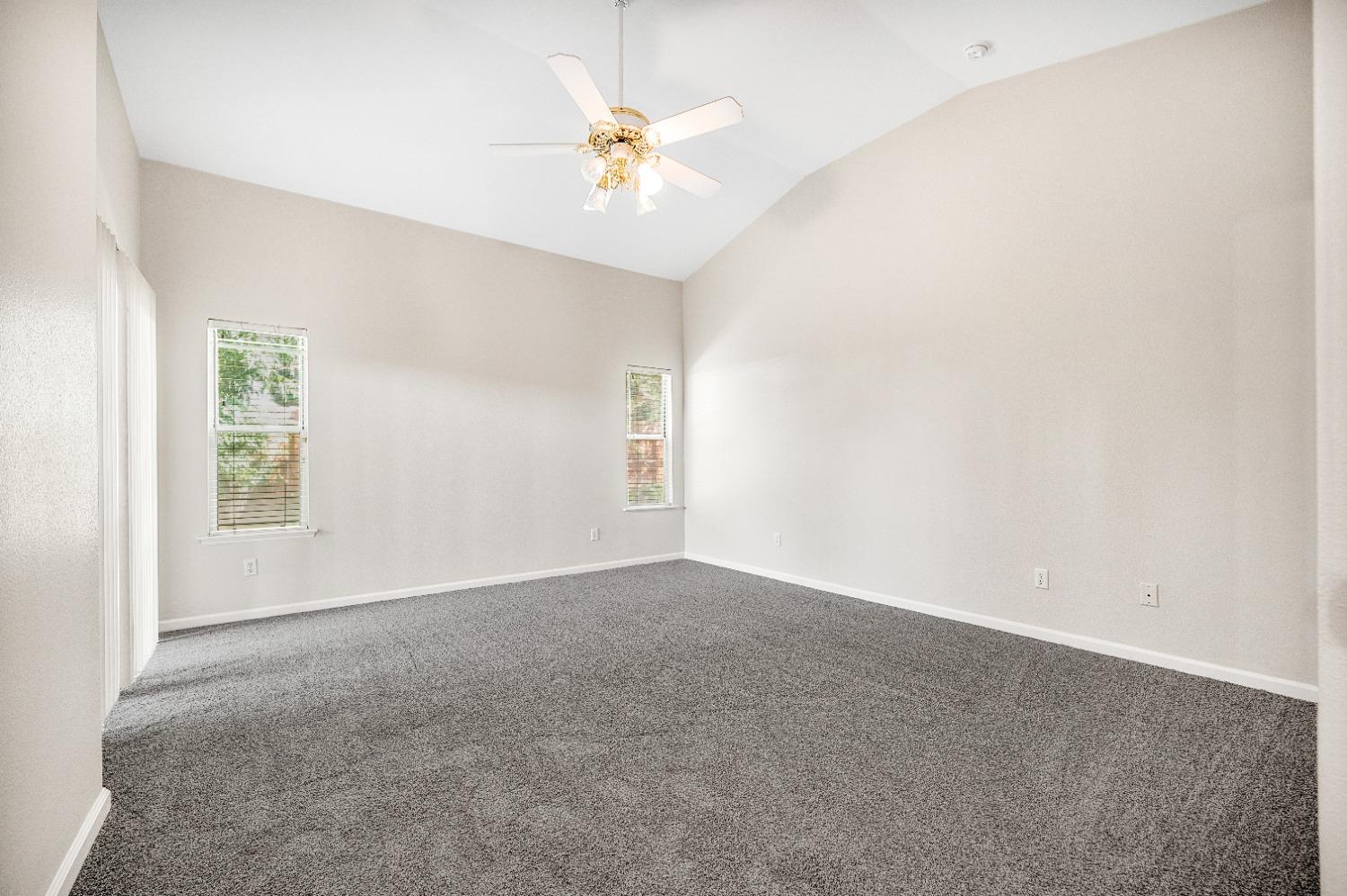 733 Applegate Avenue Clovis, CA 93611 - Photo 19 of 25 an empty room with windows and fan