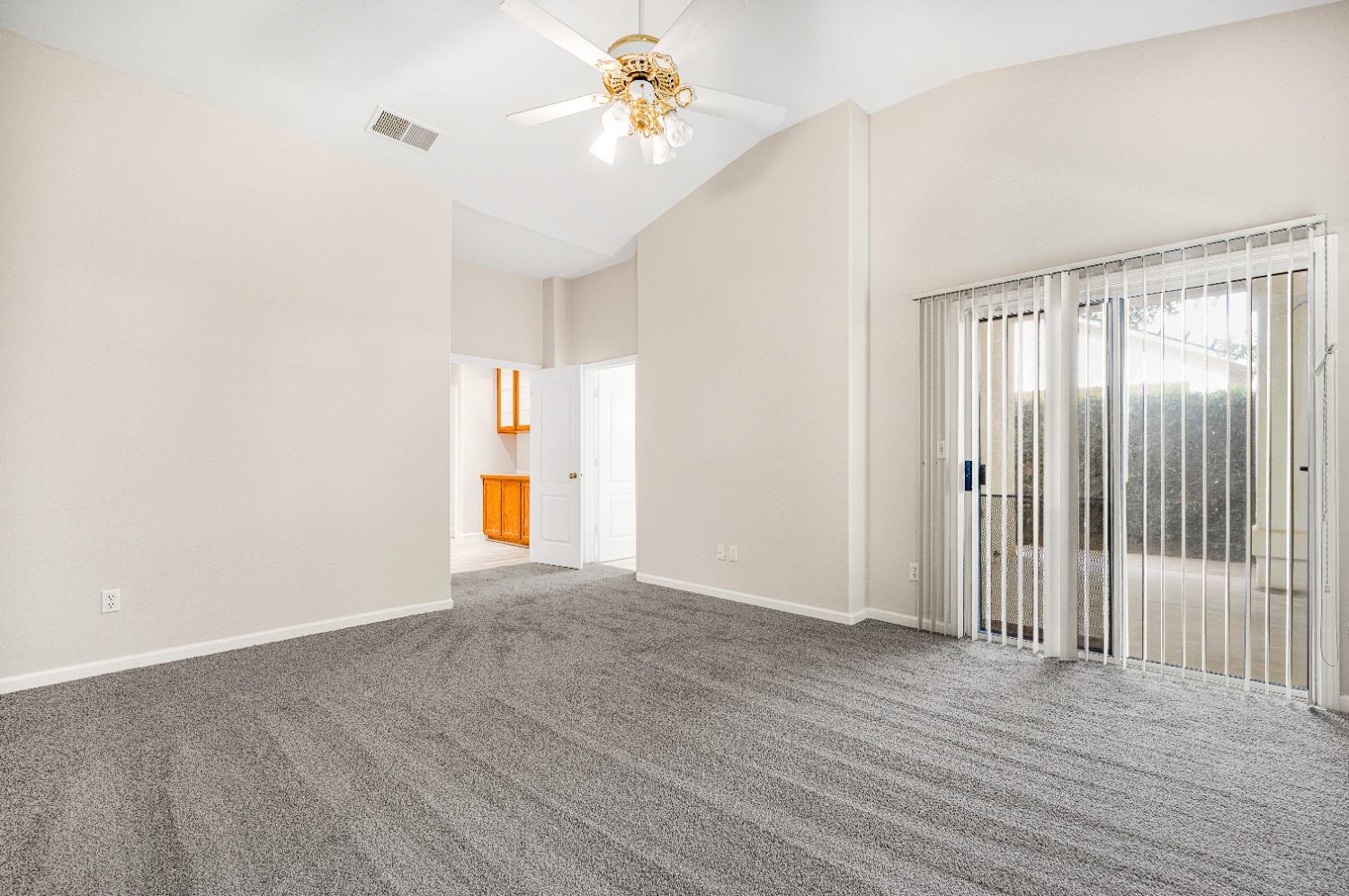 733 Applegate Avenue Clovis, CA 93611 - Photo 20 of 25 a view of empty room with wooden floor and fan