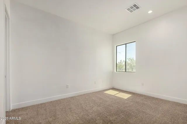 a bathroom with a granite countertop sink a toilet and a shower