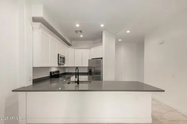 a kitchen with a sink and cabinets