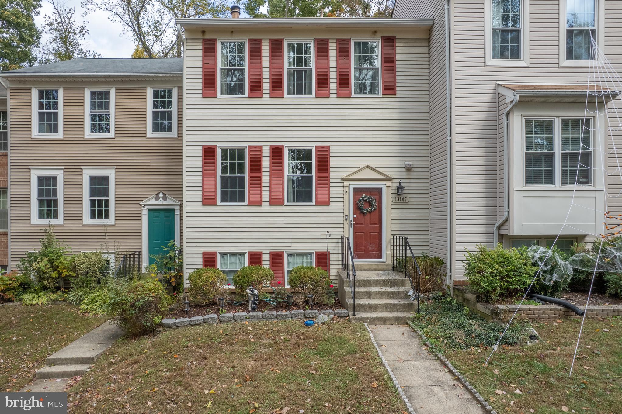 13007 Climbing Ivy Drive Germantown, MD 20874 - Photo 2 of 63 a front view of a house with garden