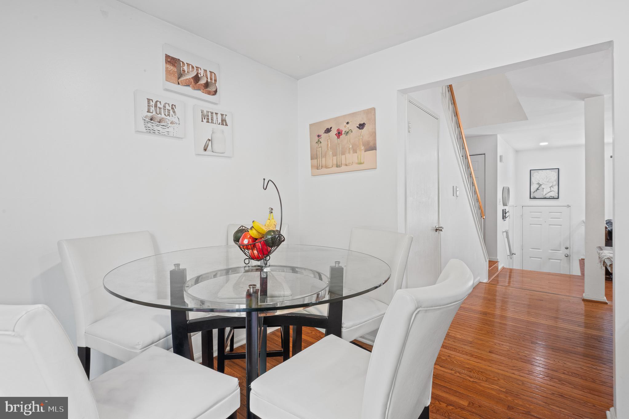 13007 Climbing Ivy Drive Germantown, MD 20874 - Photo 29 of 63 a view of a dining room with furniture and wooden floor