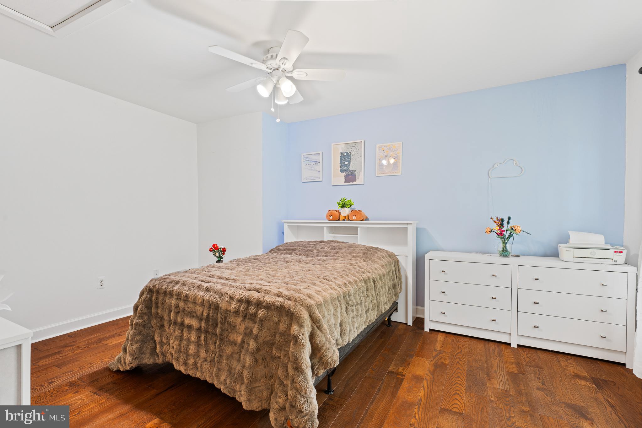 13007 Climbing Ivy Drive Germantown, MD 20874 - Photo 36 of 63 a bedroom with a bed and a chandelier