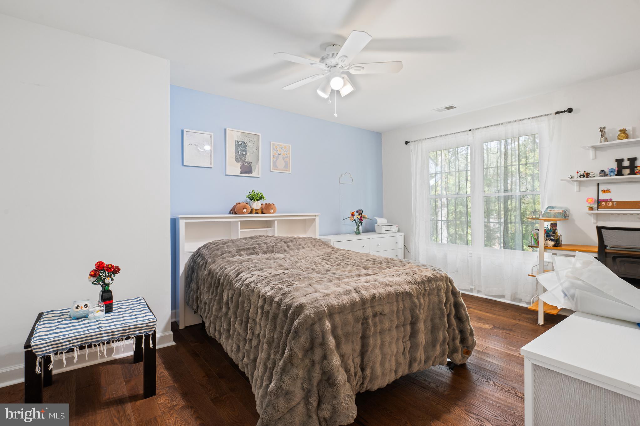 13007 Climbing Ivy Drive Germantown, MD 20874 - Photo 42 of 63 a bedroom with a bed and wooden floor
