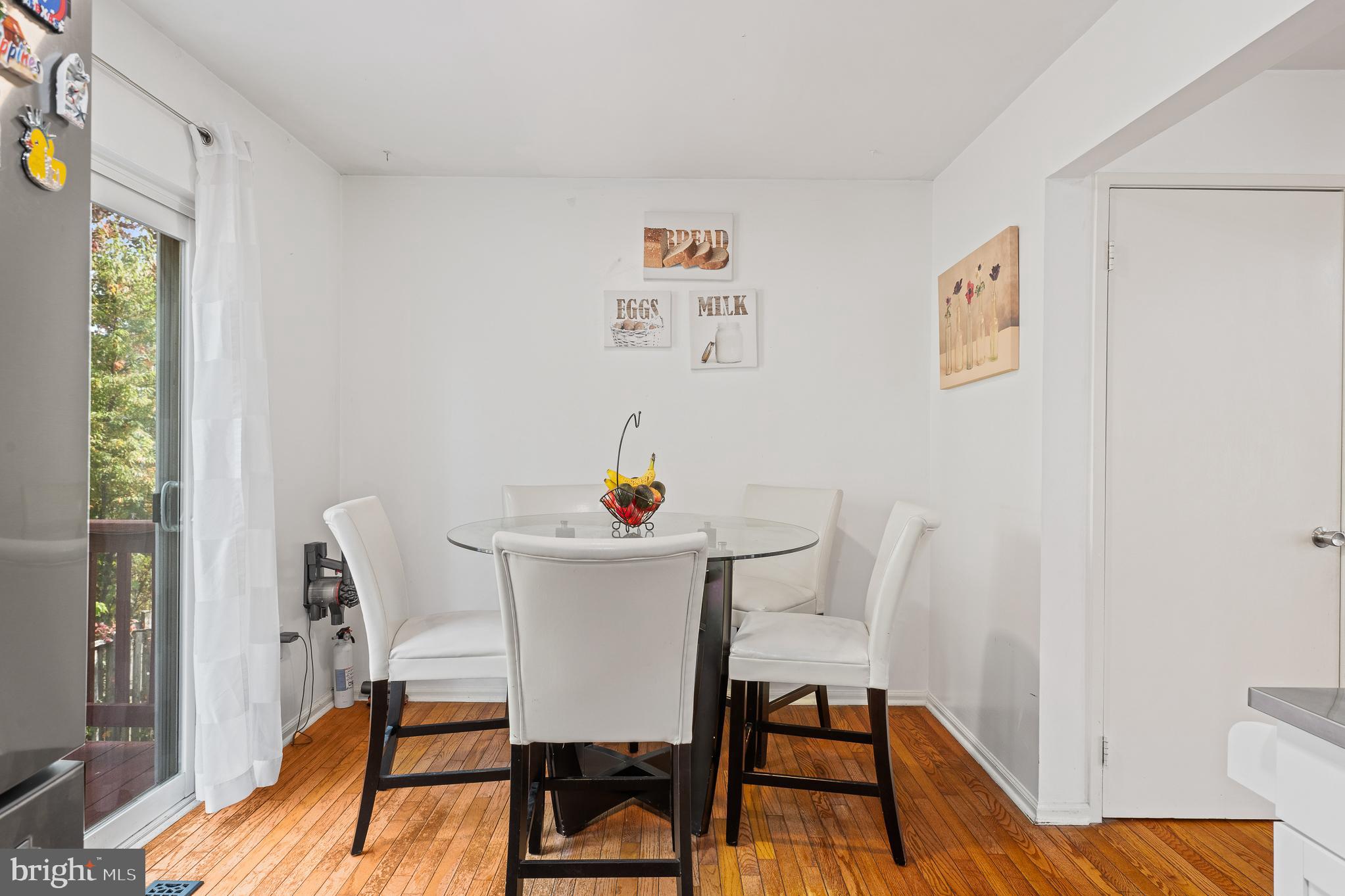 13007 Climbing Ivy Drive Germantown, MD 20874 - Photo 43 of 63 a dining room with furniture and wooden floor