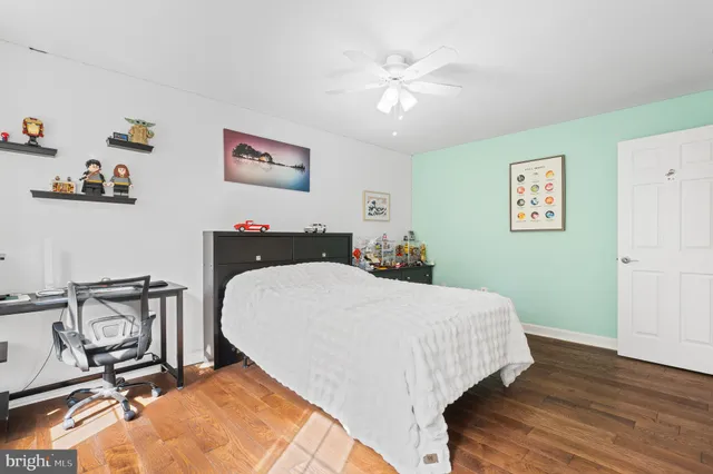 a bed room with a bed and a chair