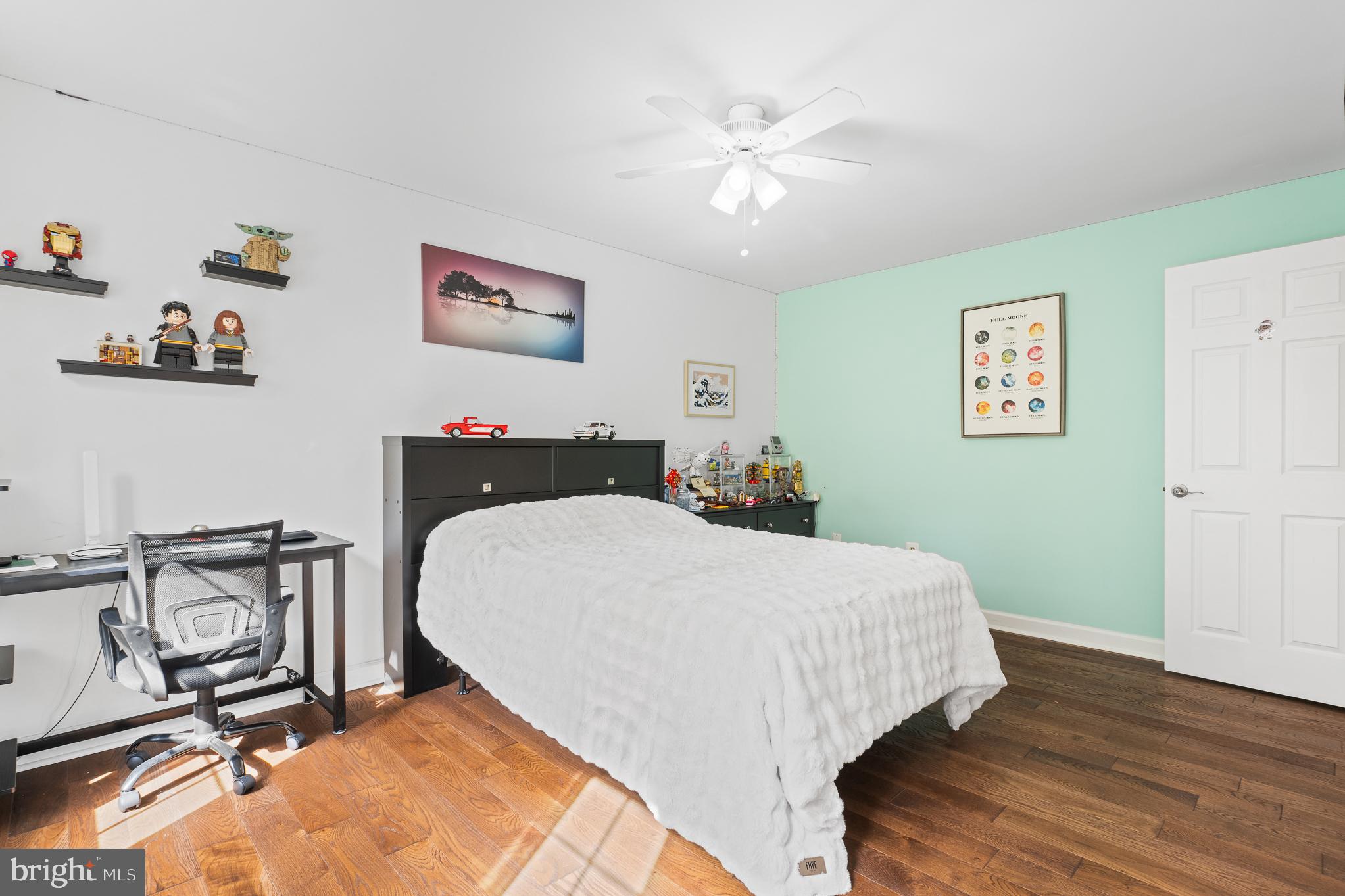 13007 Climbing Ivy Drive Germantown, MD 20874 - Photo 45 of 63 a bedroom with a bed and wooden floor
