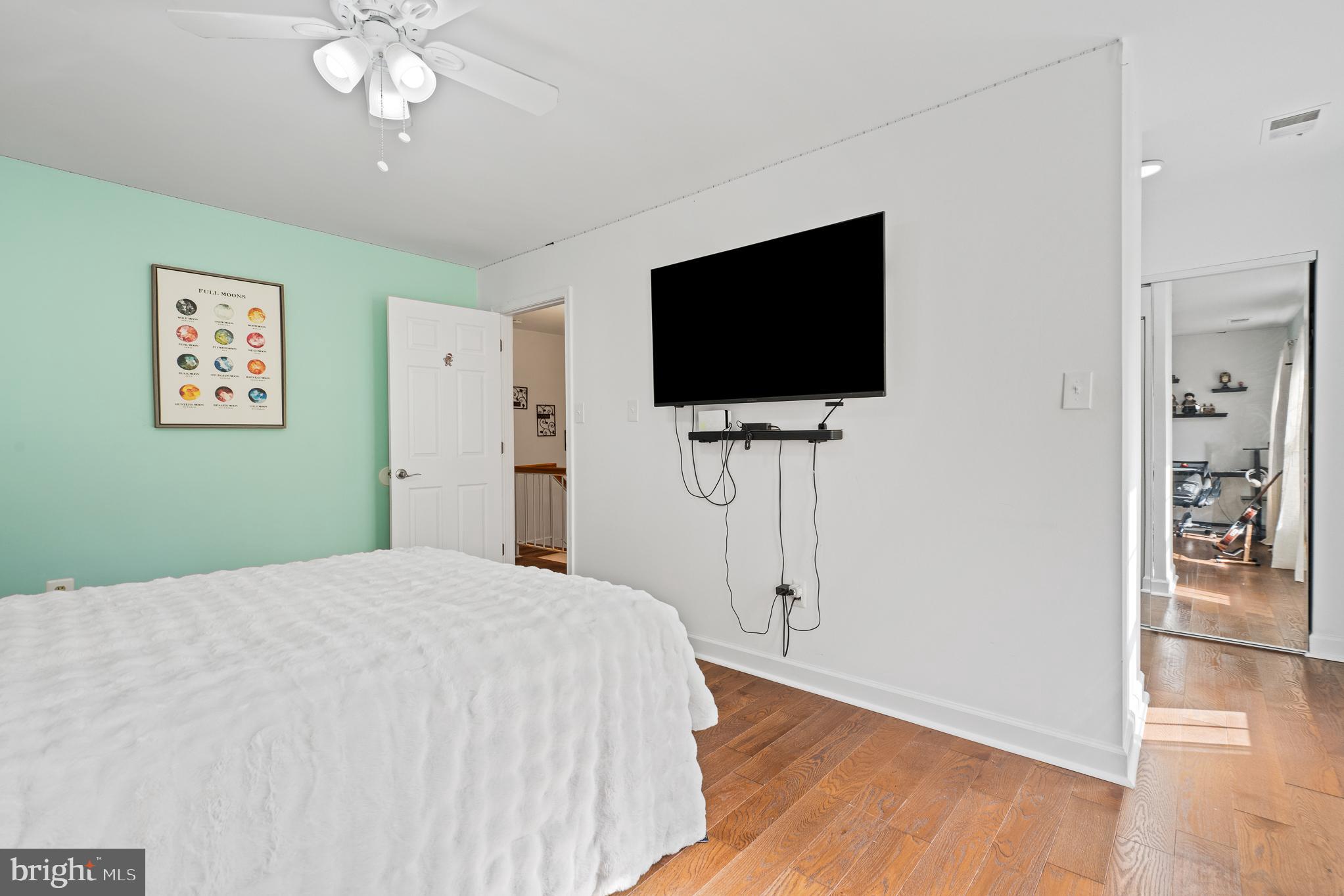 13007 Climbing Ivy Drive Germantown, MD 20874 - Photo 49 of 63 a bedroom with a bed and a flat screen tv