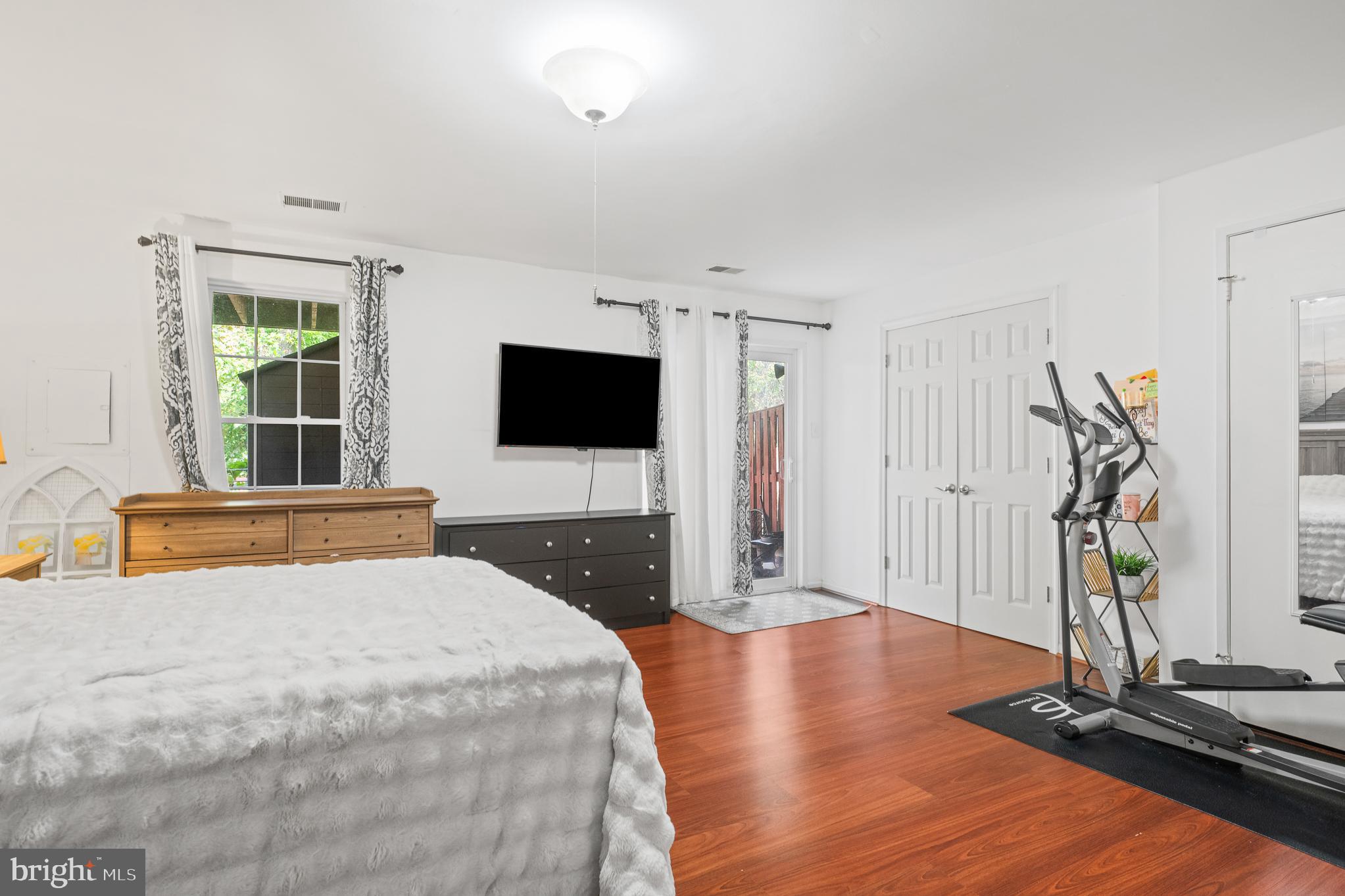 13007 Climbing Ivy Drive Germantown, MD 20874 - Photo 58 of 63 a bedroom with a bed and a flat screen tv