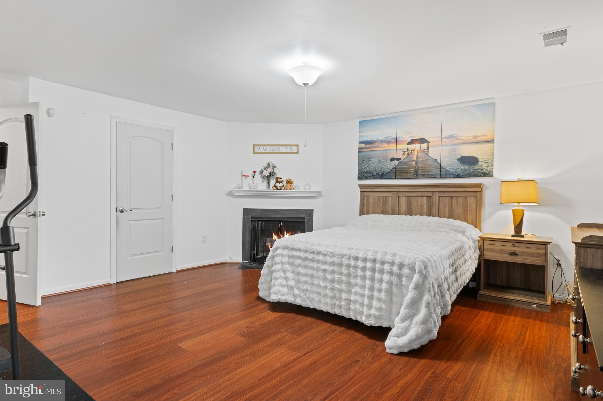 13007 Climbing Ivy Drive Germantown, MD 20874 - Photo 59 of 63 a bedroom with a bed and wooden floor