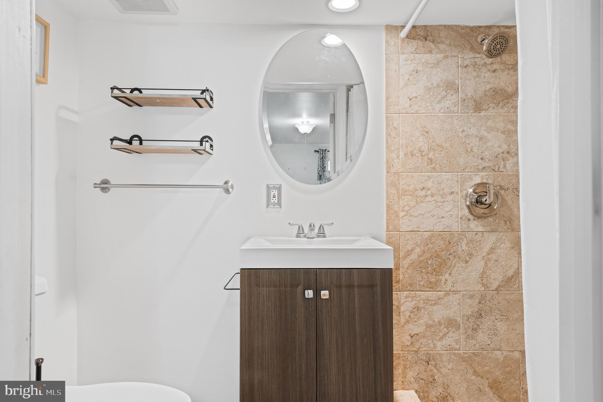 13007 Climbing Ivy Drive Germantown, MD 20874 - Photo 60 of 63 a bathroom with a sink a toilet and a mirror