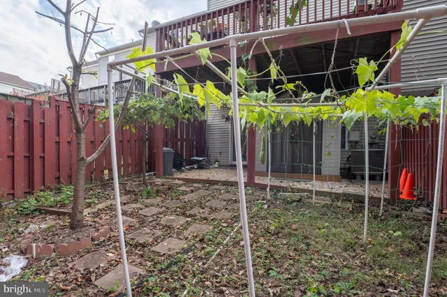 a view of a wooden door in front of a house