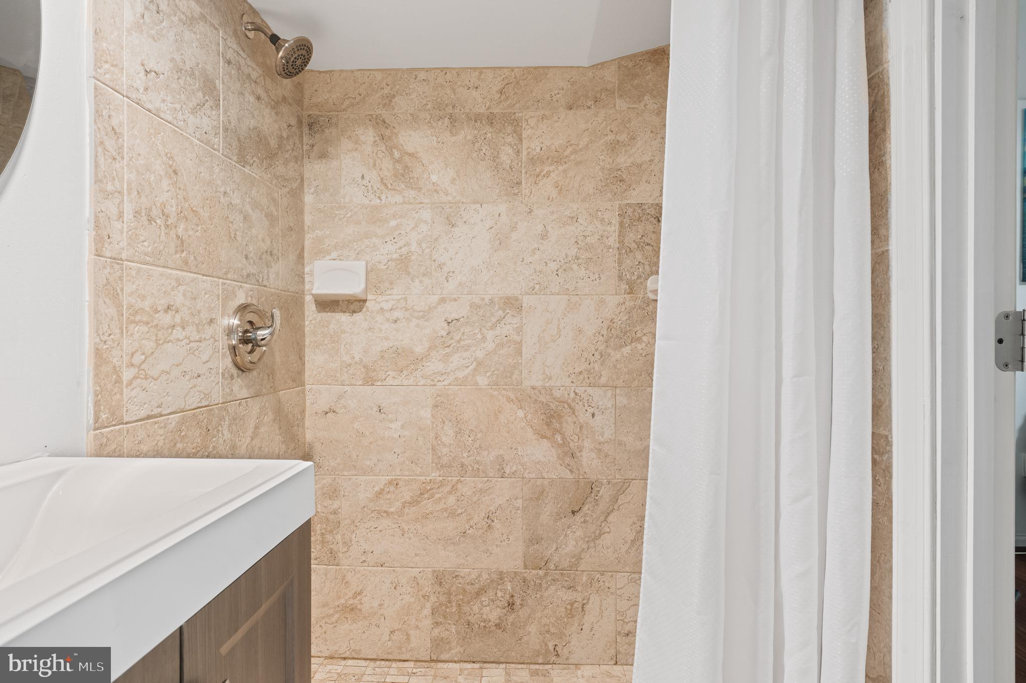 13007 Climbing Ivy Drive Germantown, MD 20874 - Photo 62 of 63 a bathroom with a sink and a shower