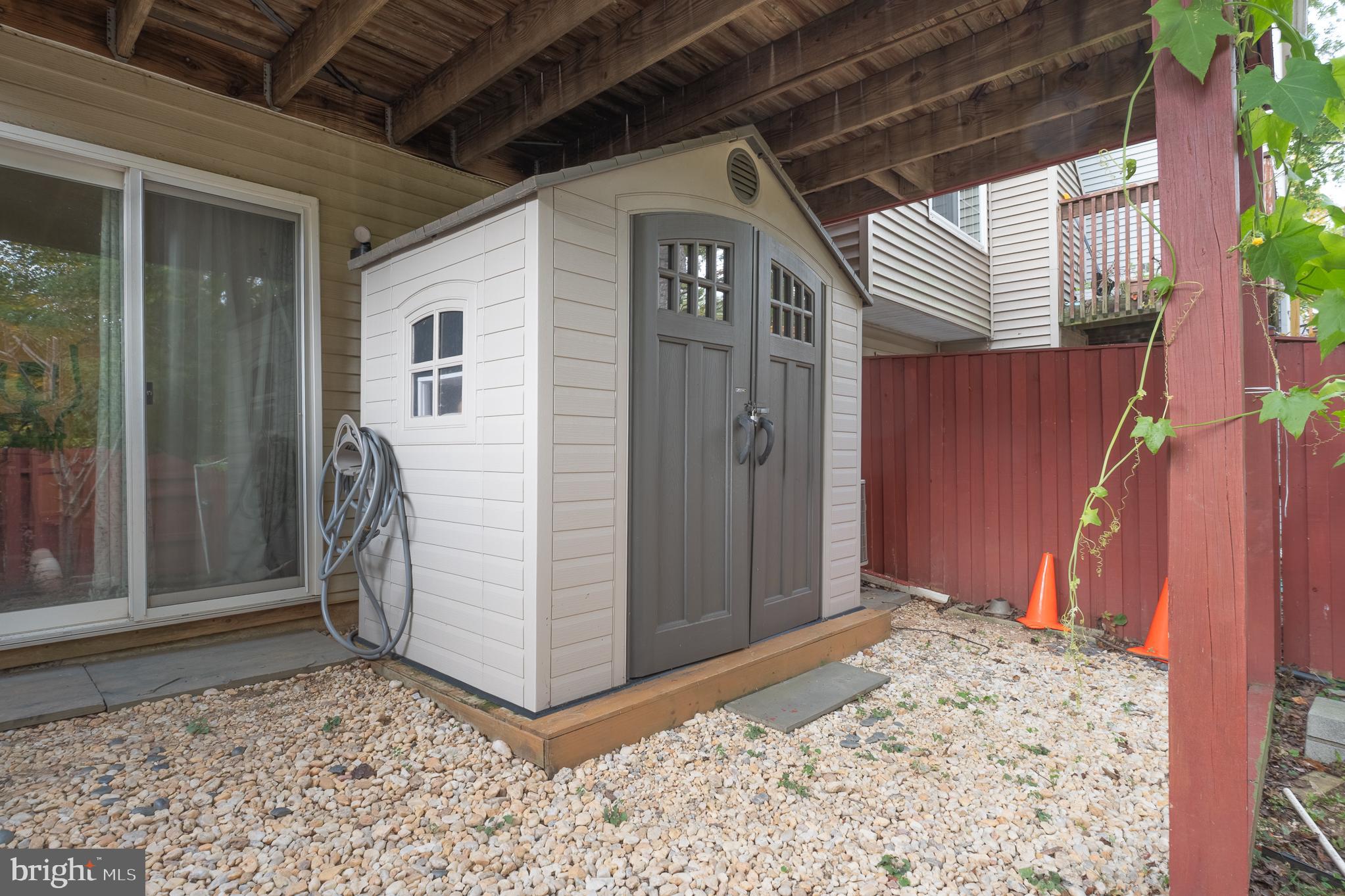 13007 Climbing Ivy Drive Germantown, MD 20874 - Photo 8 of 63 a view of a wooden door in front of a house
