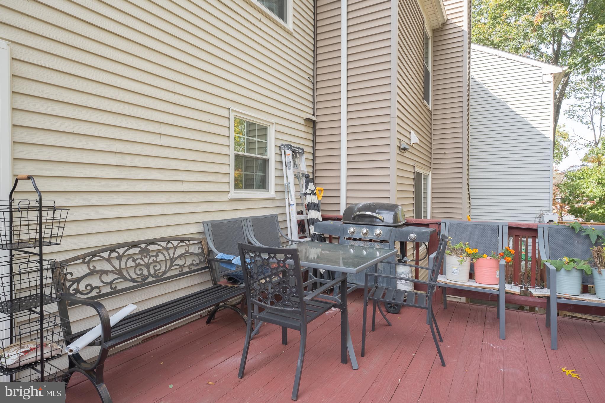 13007 Climbing Ivy Drive Germantown, MD 20874 - Photo 9 of 63 a patio with table and chairs