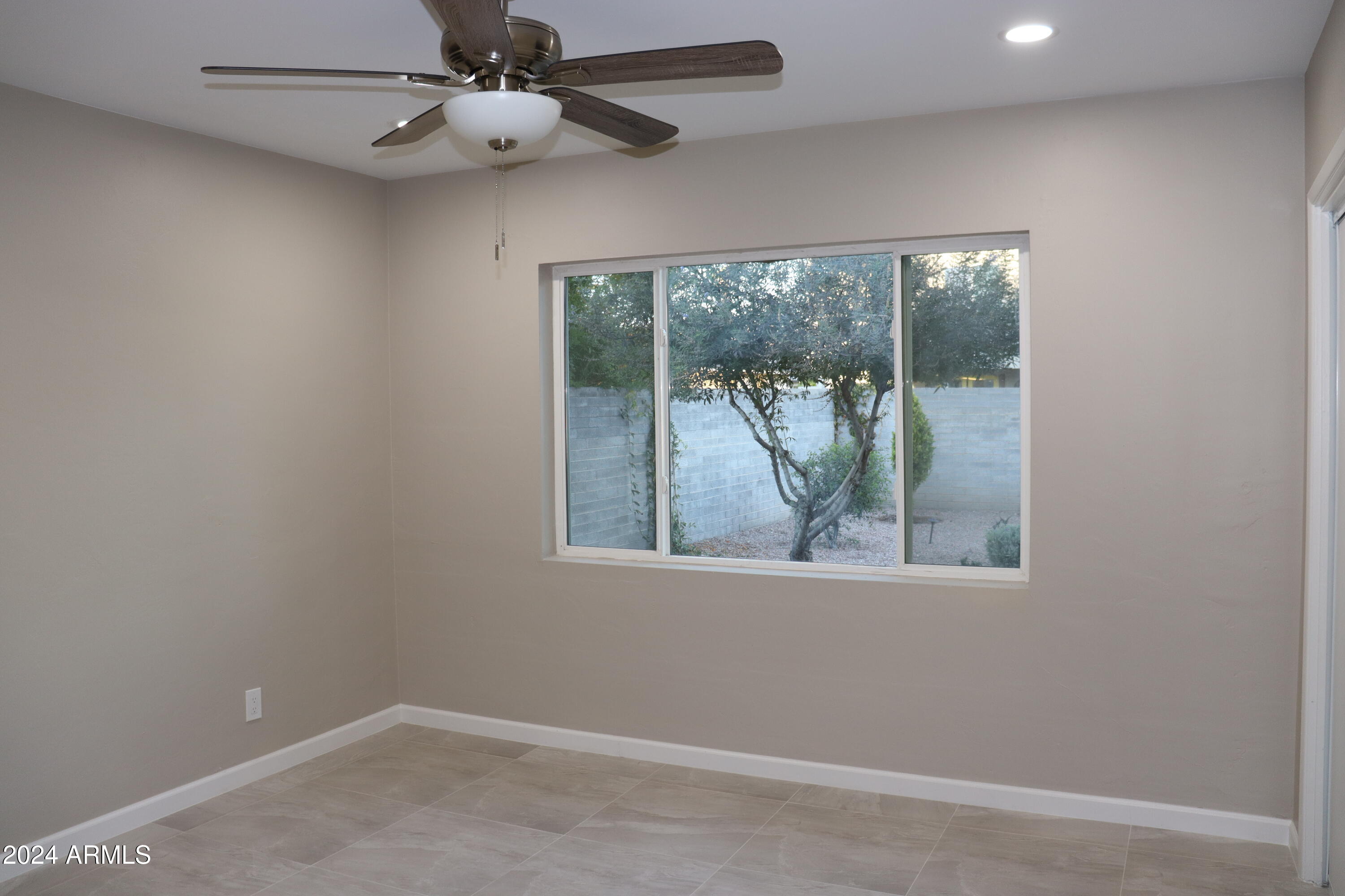 6702 East Almeria Road Scottsdale, AZ 85257 - Photo 13 of 23 an empty room with a window