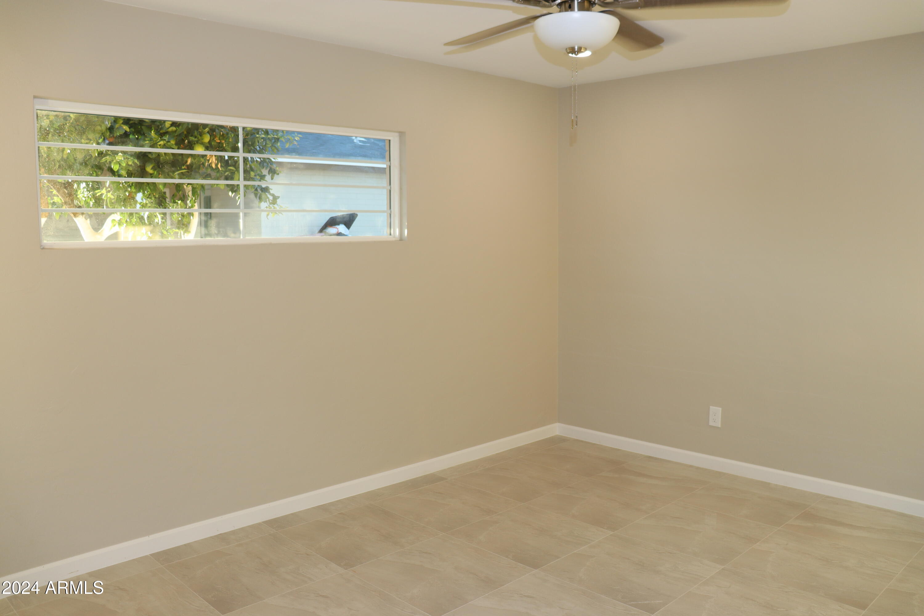 6702 East Almeria Road Scottsdale, AZ 85257 - Photo 16 of 23 a view of an empty room with a window