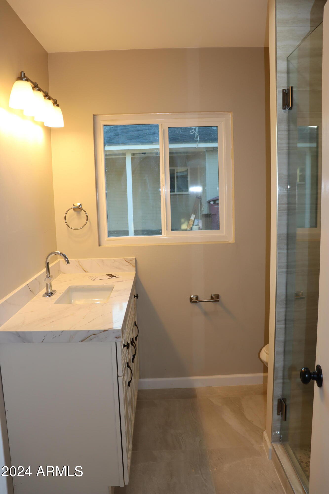 6702 East Almeria Road Scottsdale, AZ 85257 - Photo 17 of 23 a bathroom with a sink and a mirror