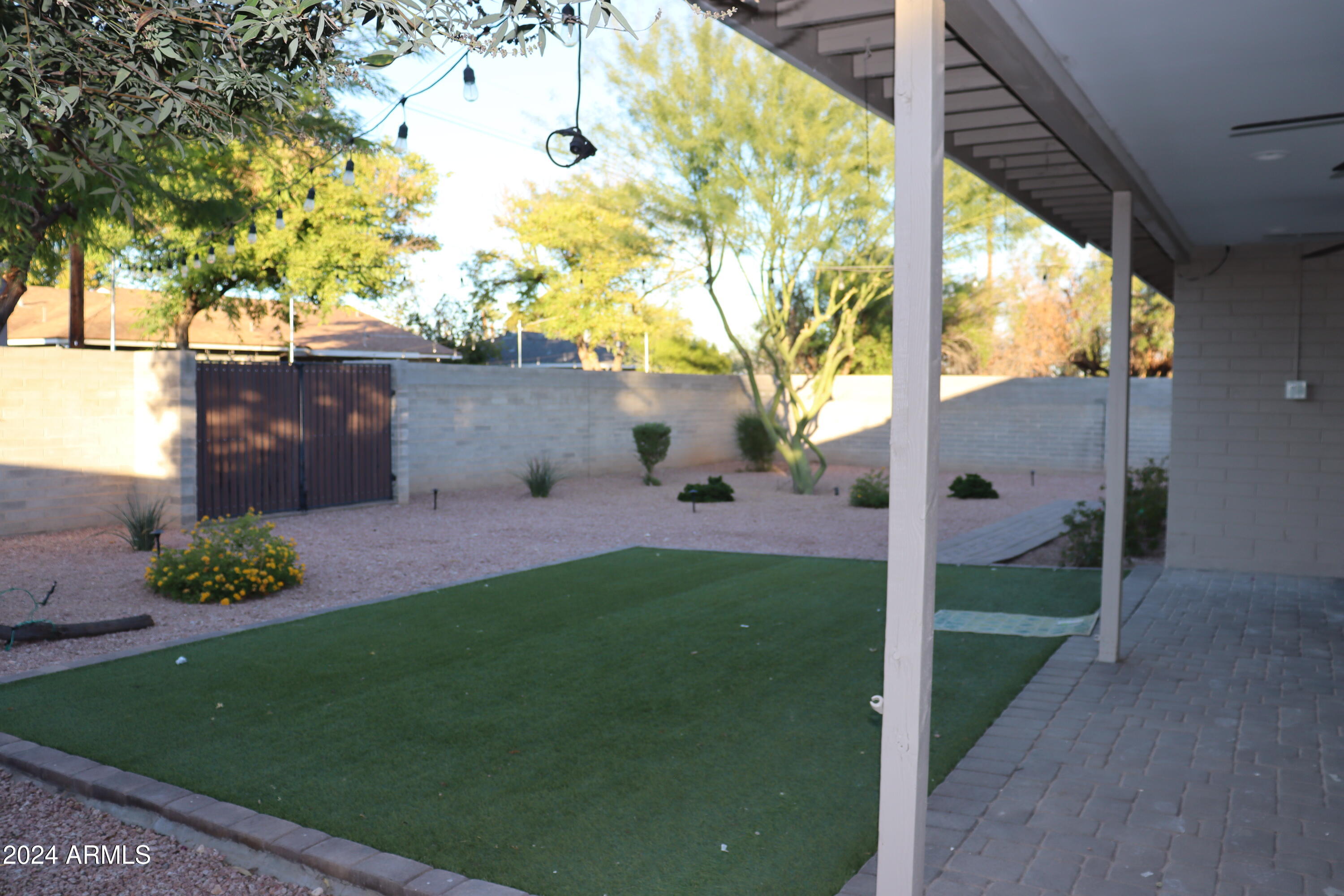 6702 East Almeria Road Scottsdale, AZ 85257 - Photo 21 of 23 a view of a garden with a tree in front of it